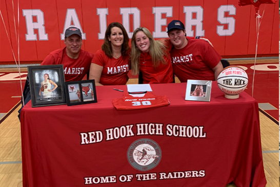 Photo of Morgan Tompkins signing with Marist College